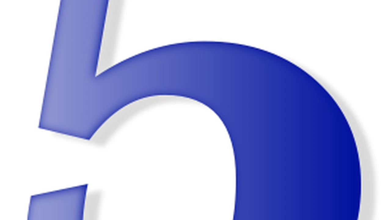 Close up on a plate of mashed potatoes, topped with baked pork chops with cream of mushroom soup, and a side of green beans.