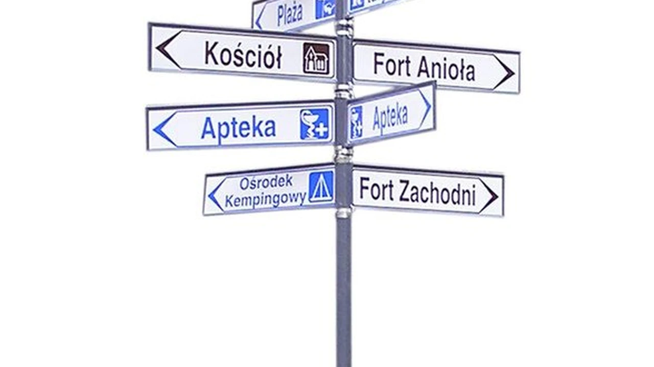 Close up on a plate of mashed potatoes, topped with baked pork chops with cream of mushroom soup, and a side of green beans.